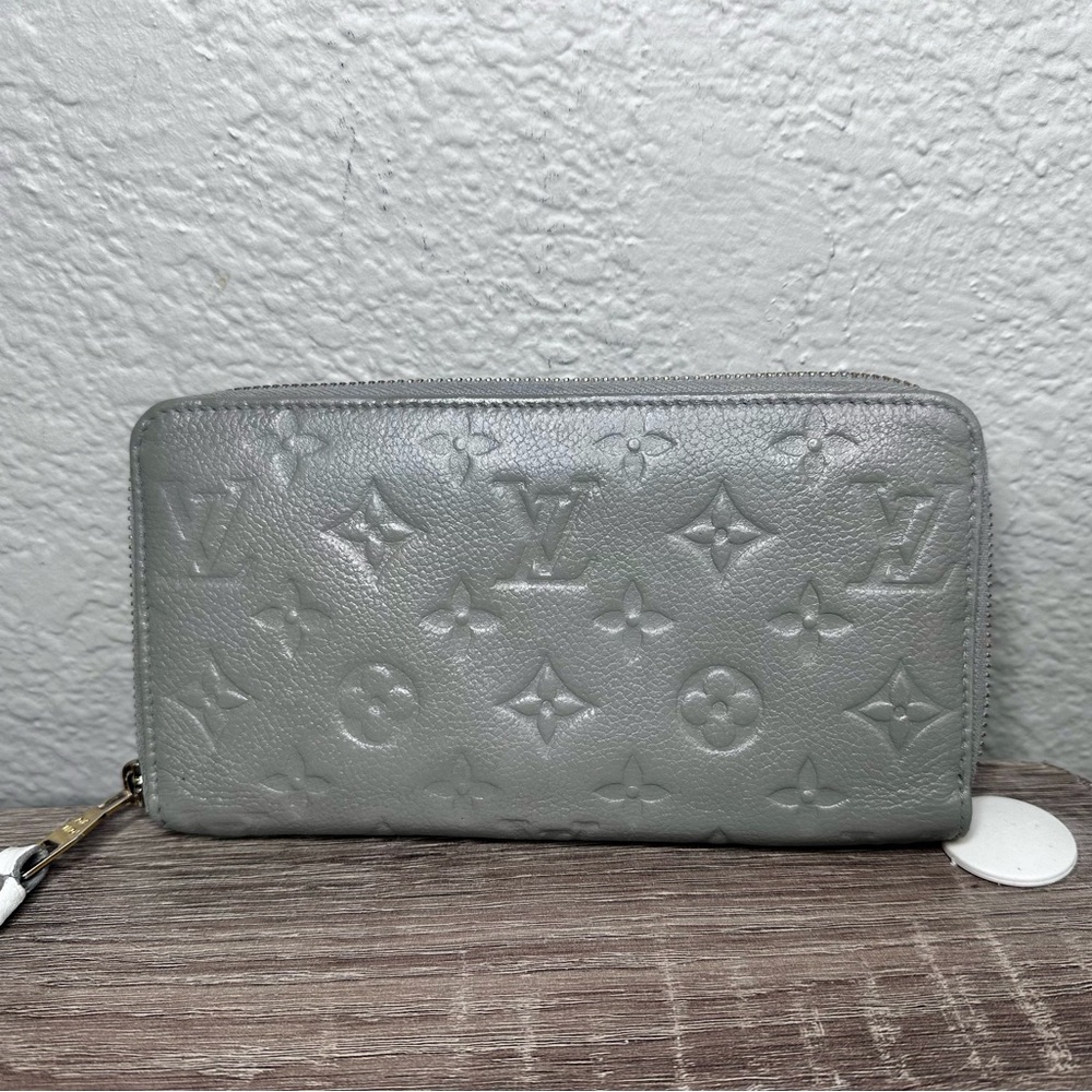 Louis Vuitton Monogram Empreinte Gray Wallet cream interior.